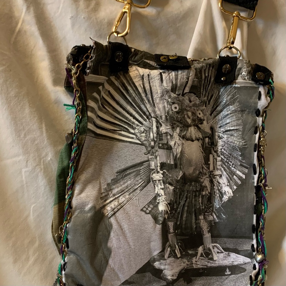 Camouflage Crossbody Bag with Gold Accents and Image of JK Punkmetal Sculpture. - Picture 6 of 7